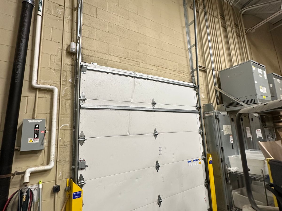 Industrial commercial garage door with mechanical opener system